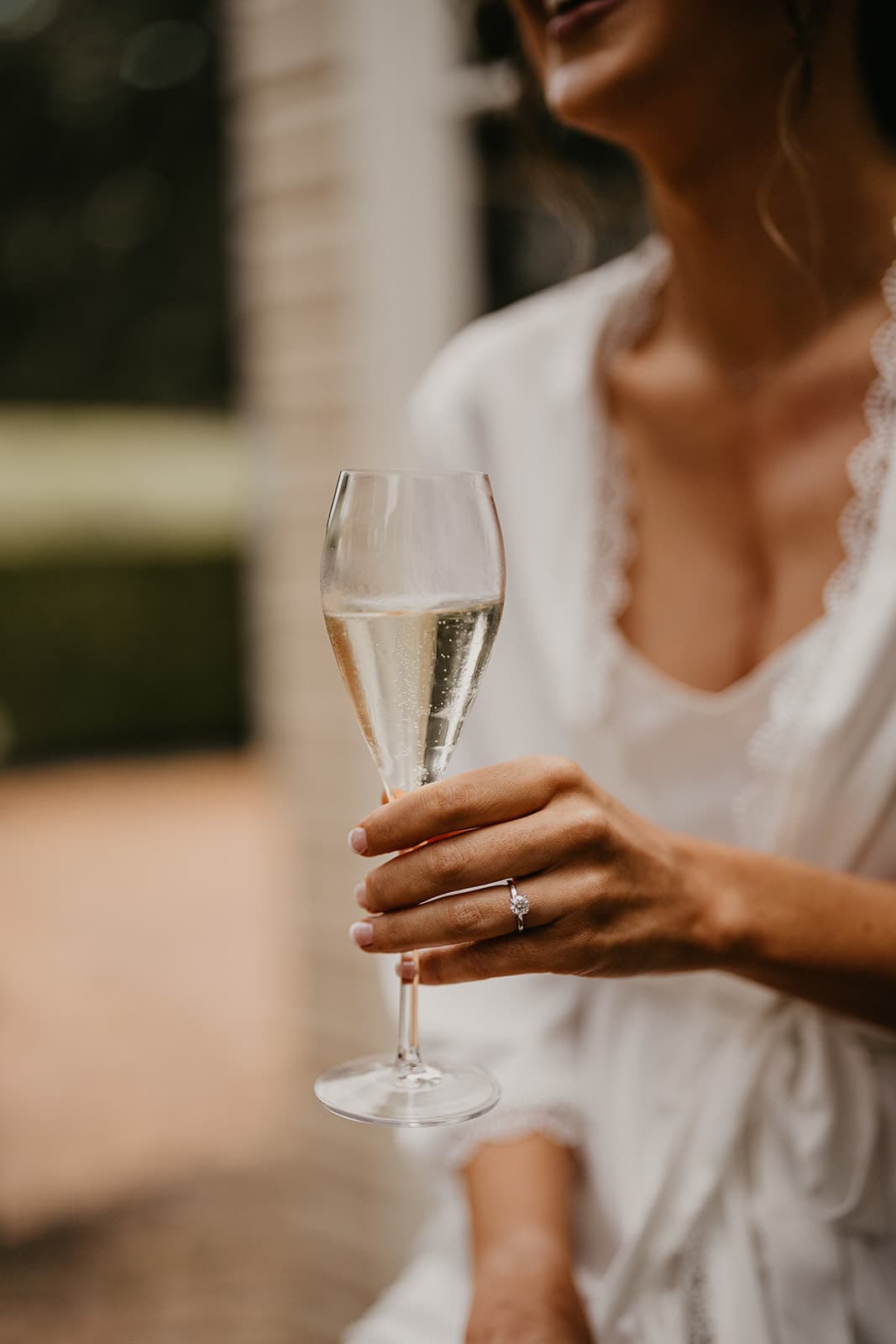 Bride drinking champagne