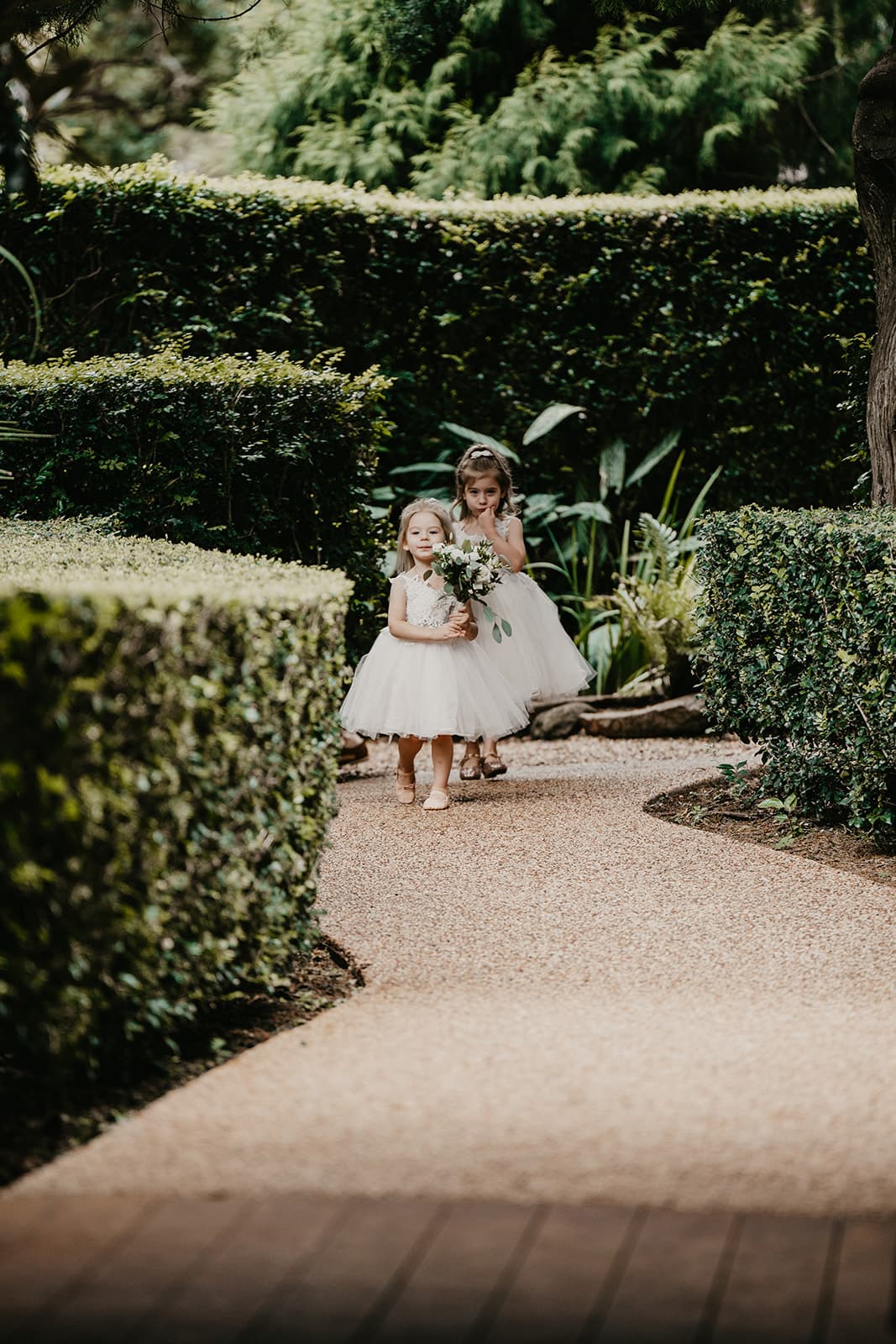 Flower girls walking down the aisle