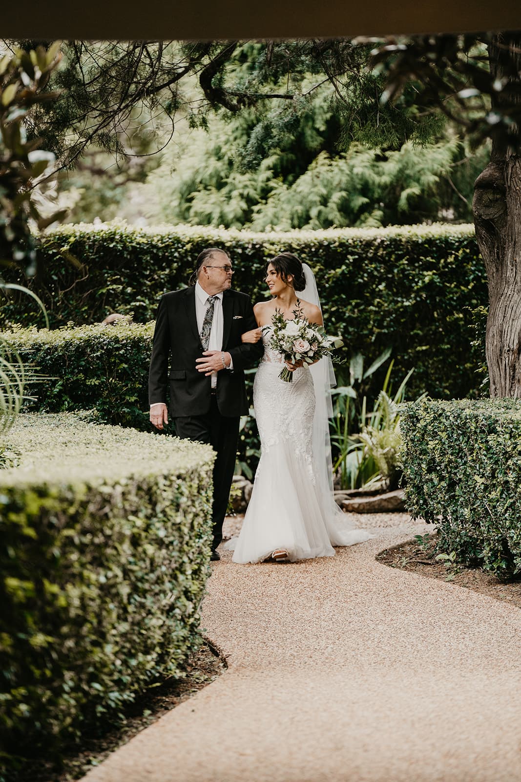 Bride and father of bride walking down the aisle