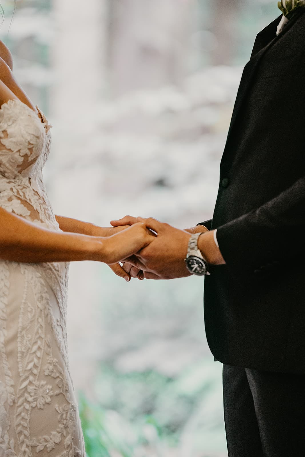 Bride and groom holding hands