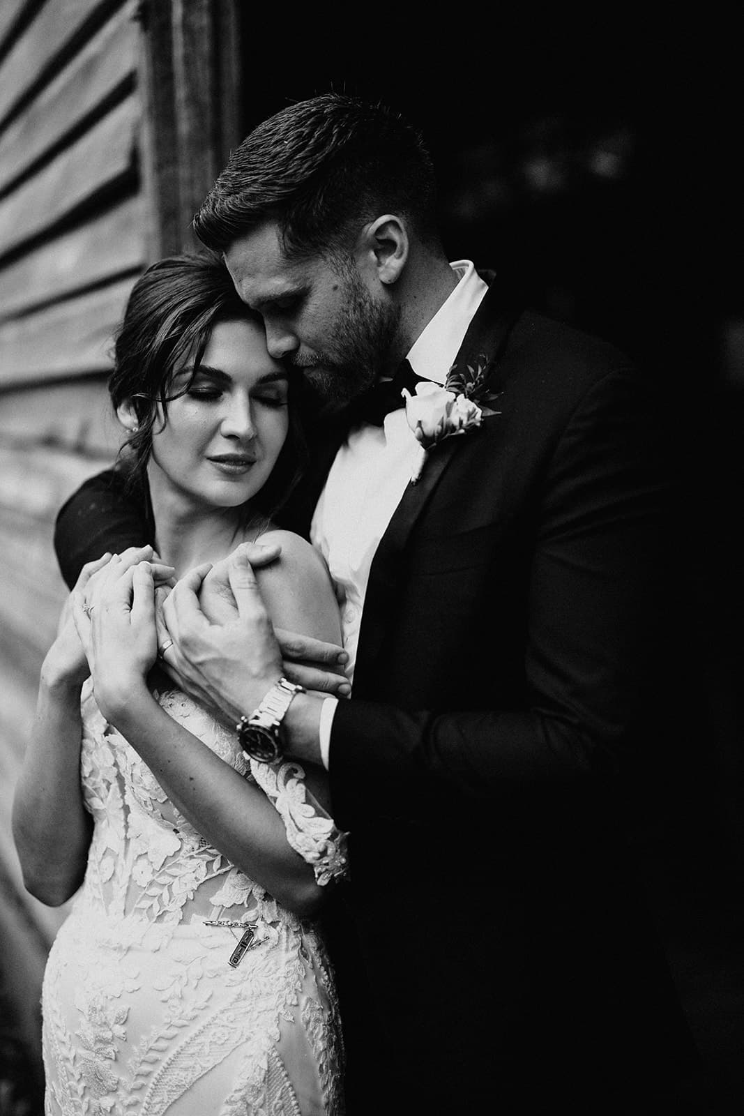 Bride and groom embracing