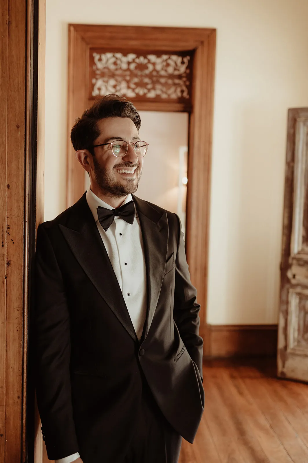 Groom dressing in suit for wedding