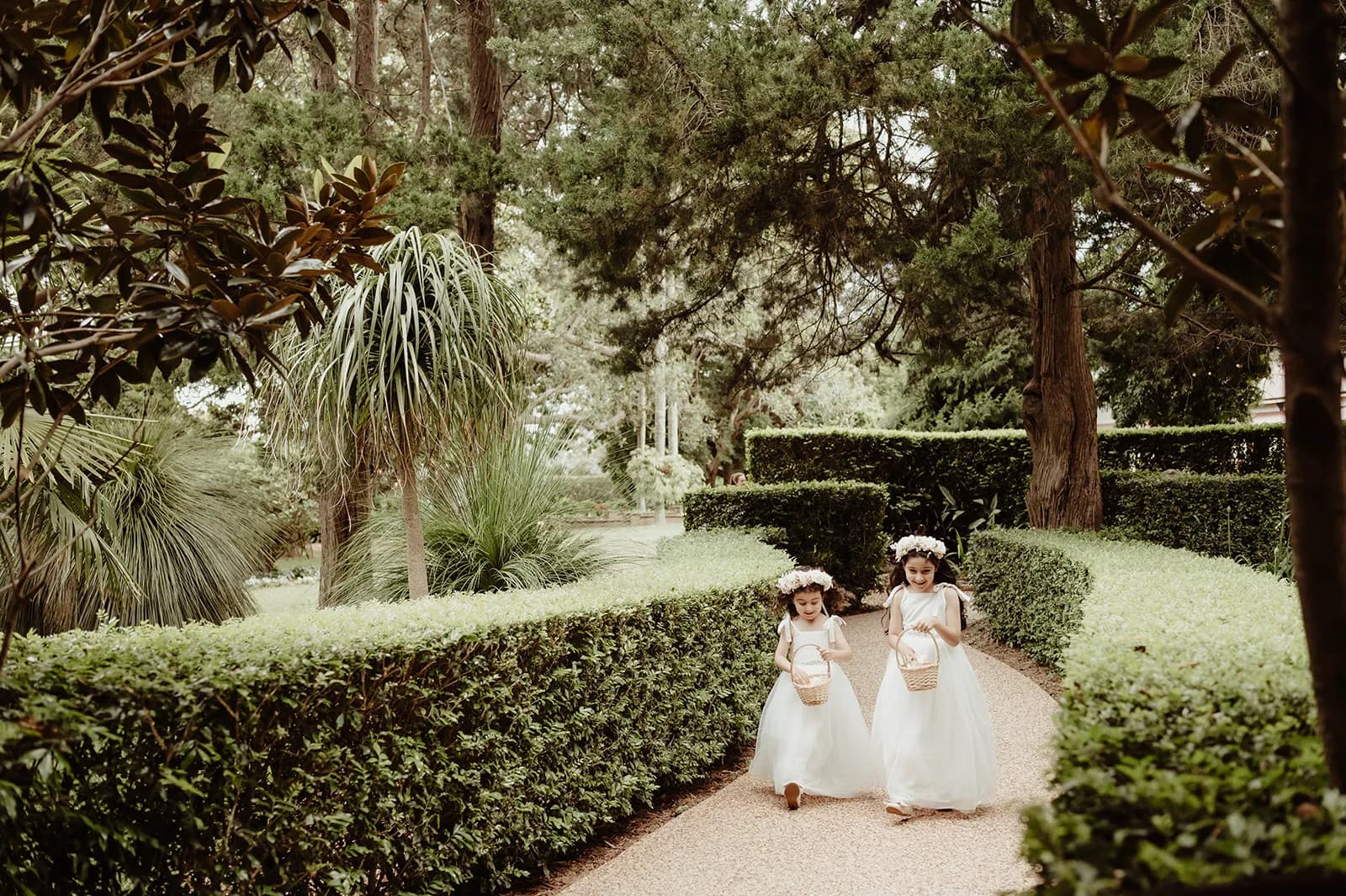 Flower girls walking down the aisle