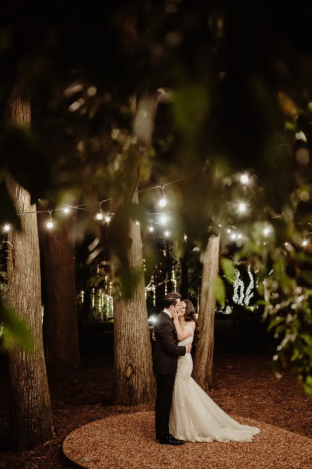 Bride and groom dancing outside