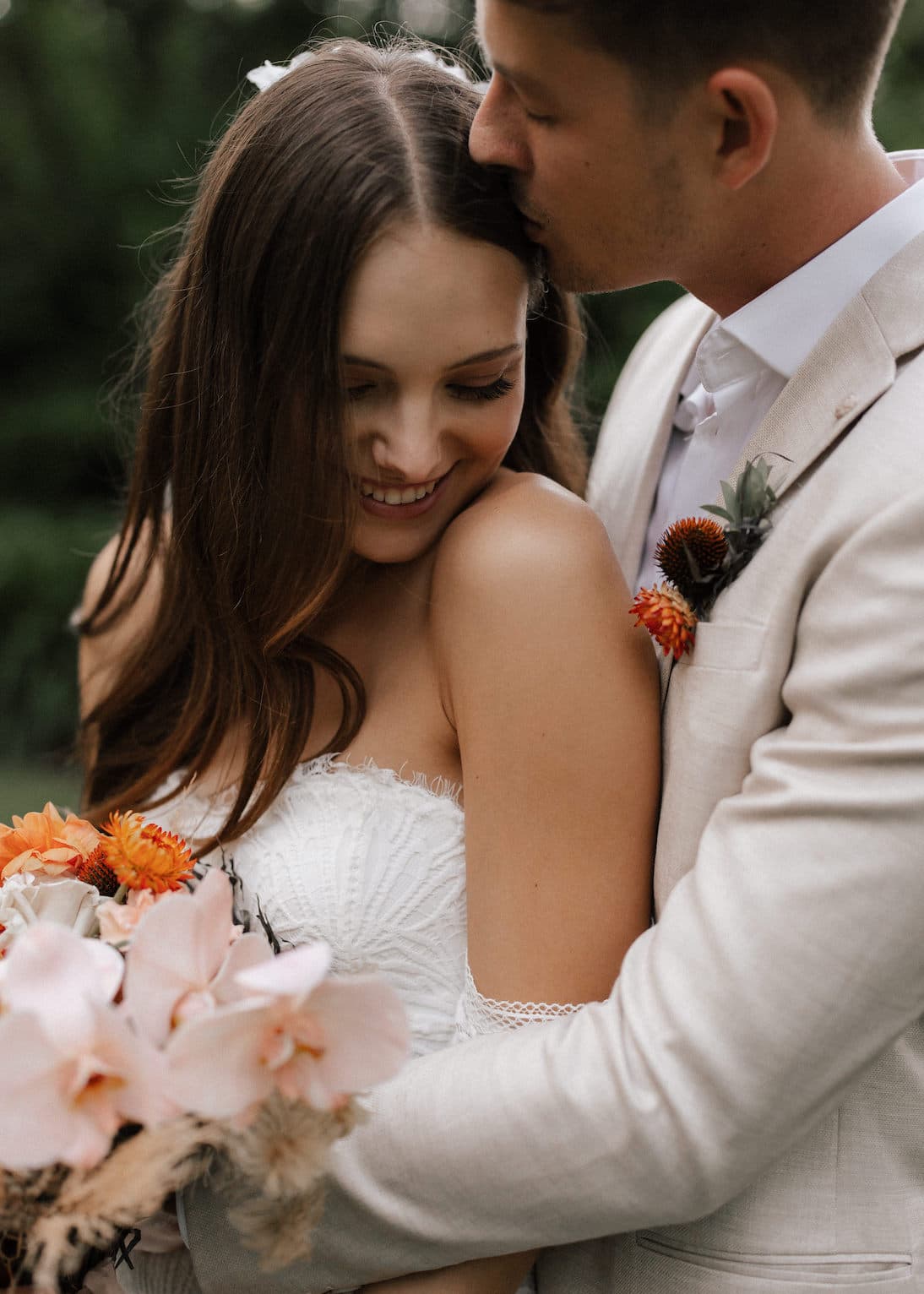 a happy couple in an embrace on their wedding day