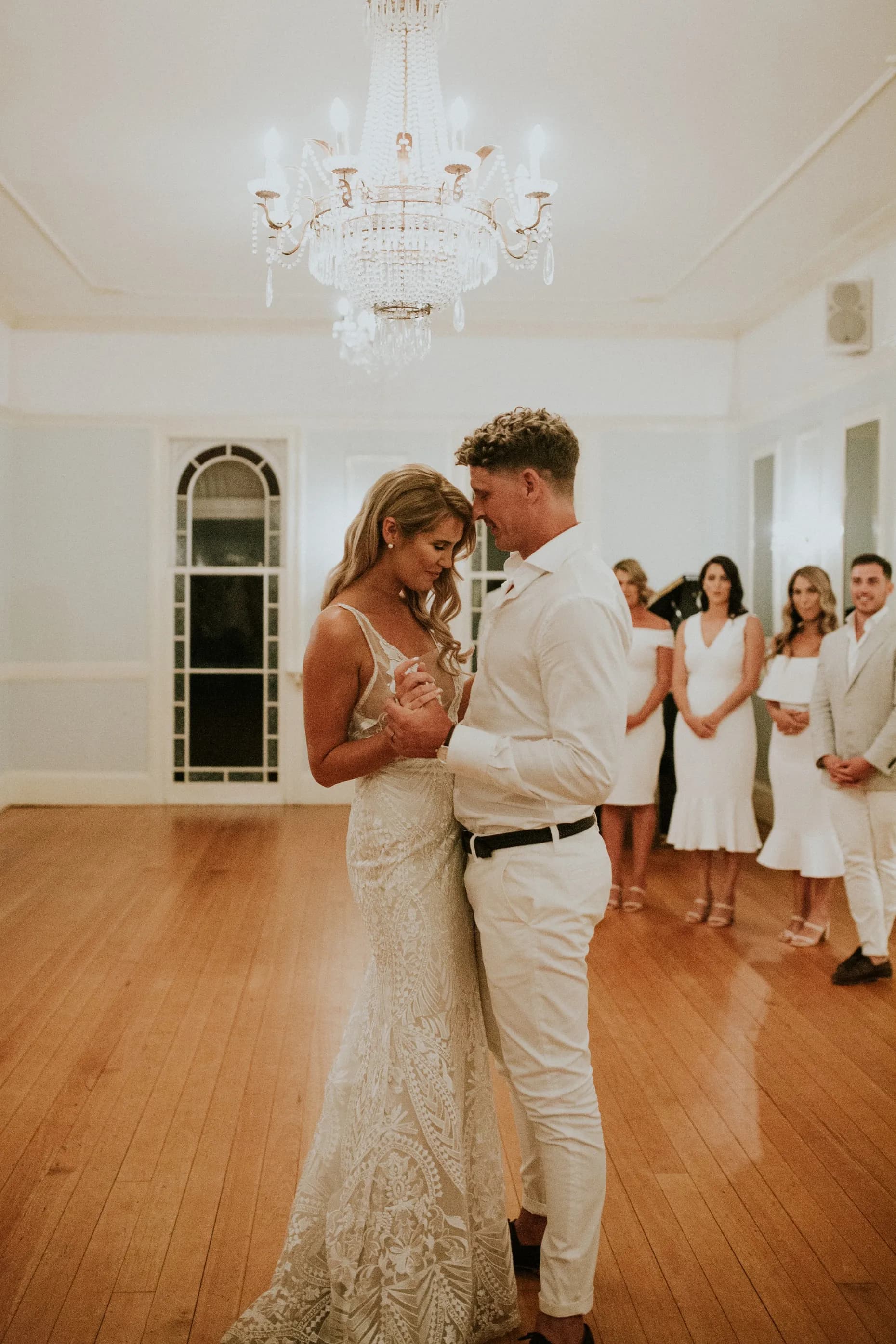 Bride and groom dancing in a ballroom