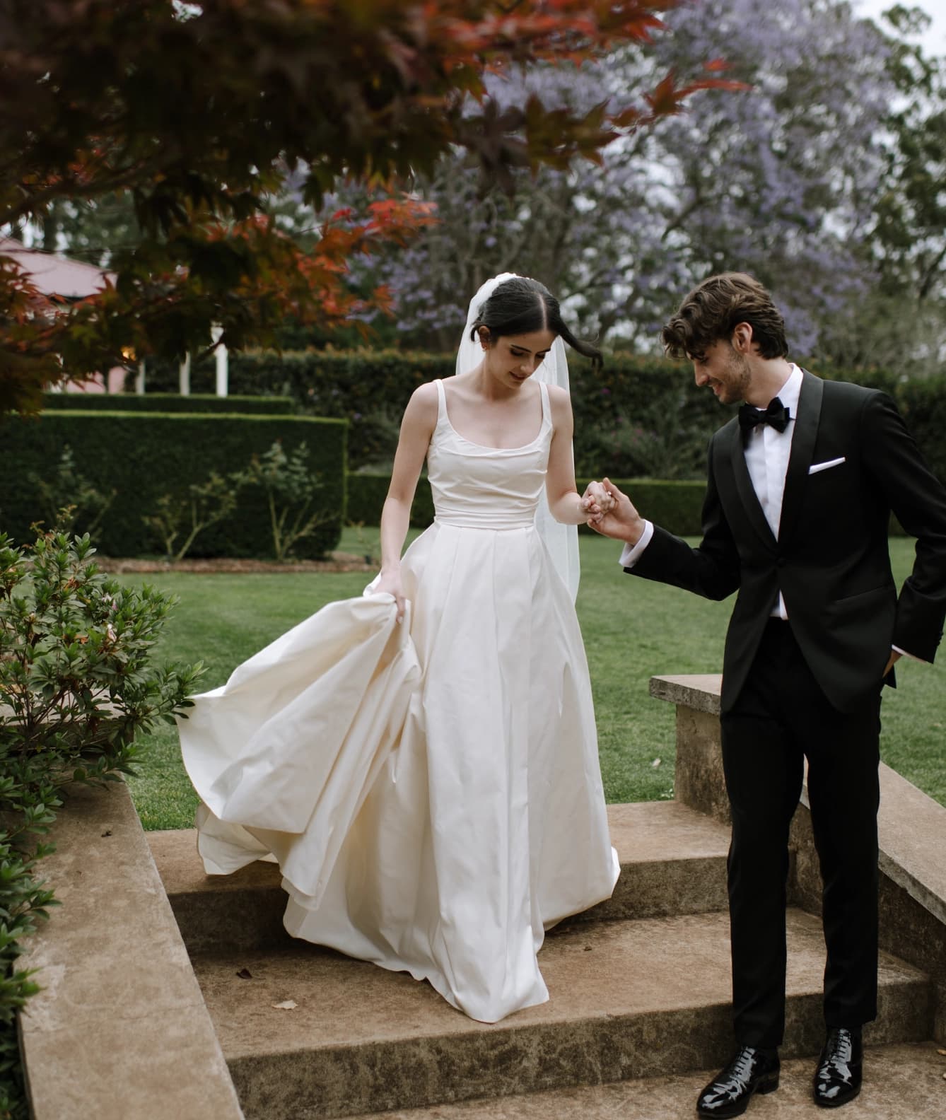 couple walk together in the gardens of Gabbinbar