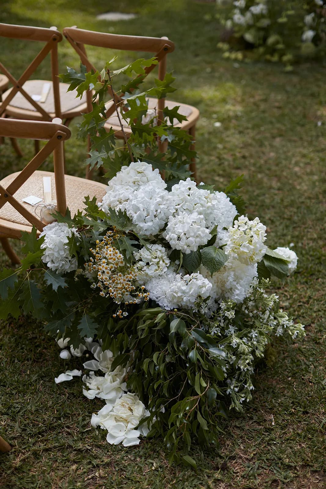 Wedding chairs with flowers by side