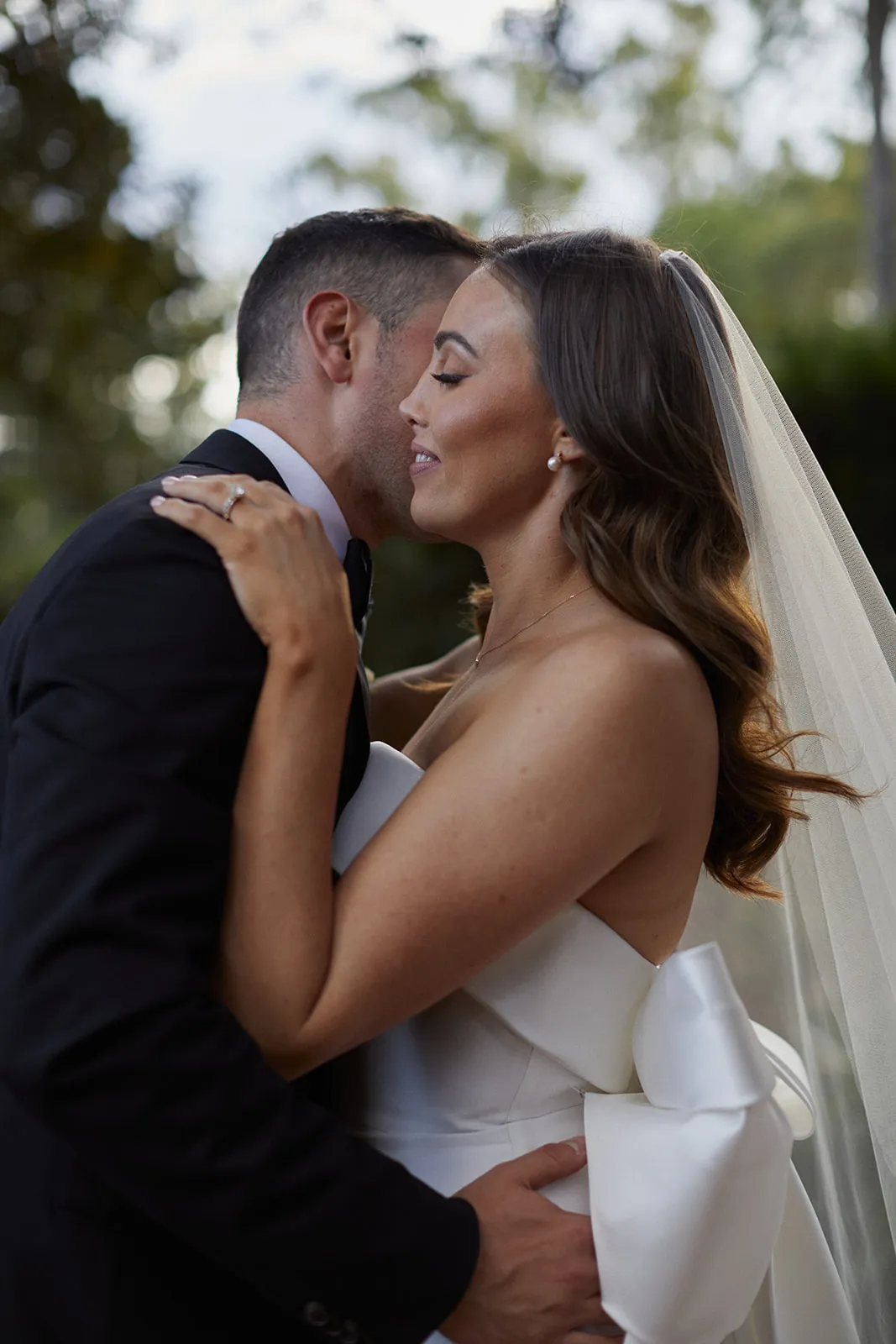 Bride and groom embracing