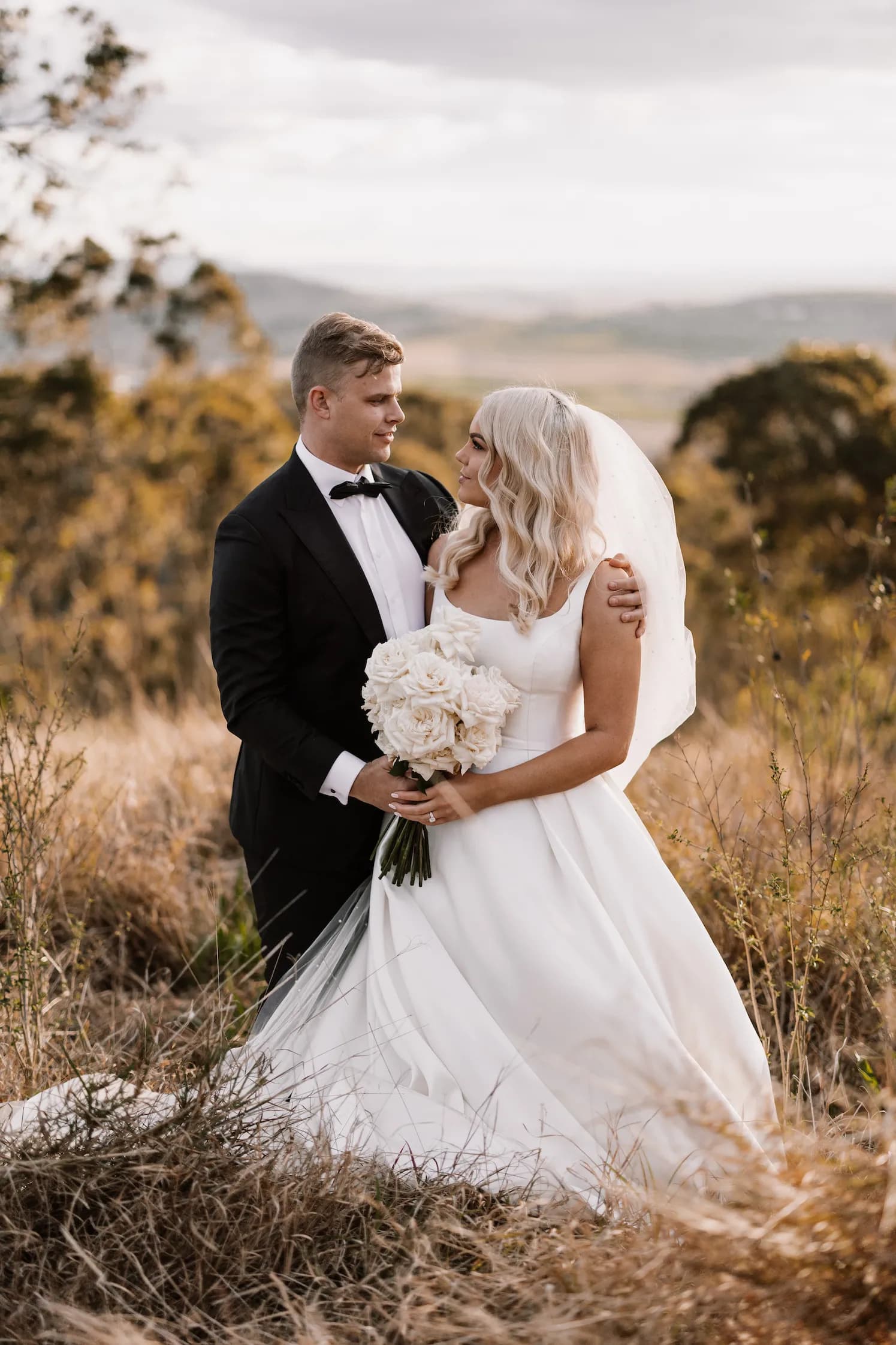 Bride and groom looking at each other